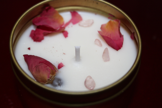 love candle with rose quartz crystal